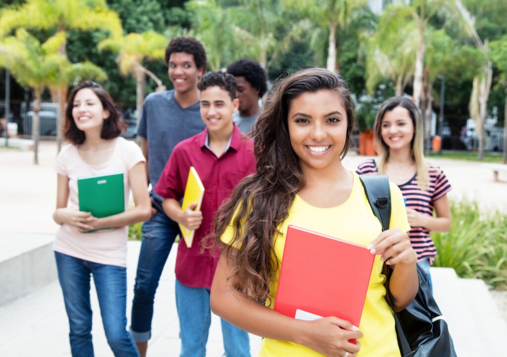 Latin american female student with group of international students
